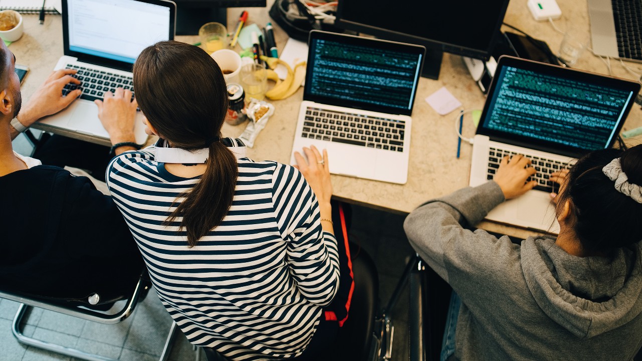 A team working in a work space; image is for navigation to CRPQ section