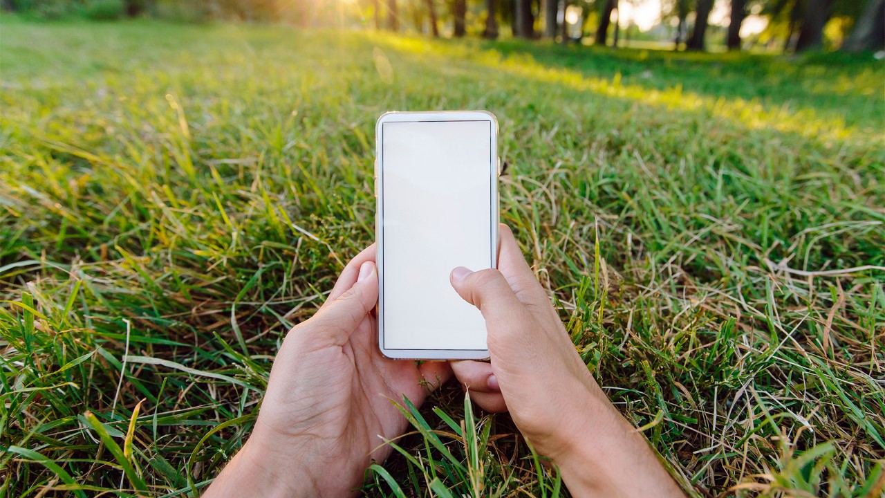 A man using his mobile; image used for eNotification page