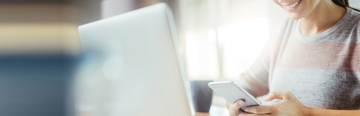 A woman is using her mobile; image used in digital services highlights