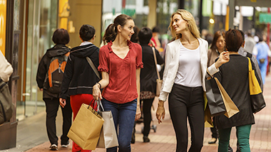 Two ladies have just finished shopping; image used for HSBC Reward Cash Program.