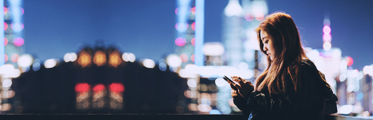 A woman is using smart phone; image used for HSBC Hong Kong Cybersecurity and Fraud Prevention Information Center.